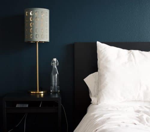 hotel bed pillow and nightstand